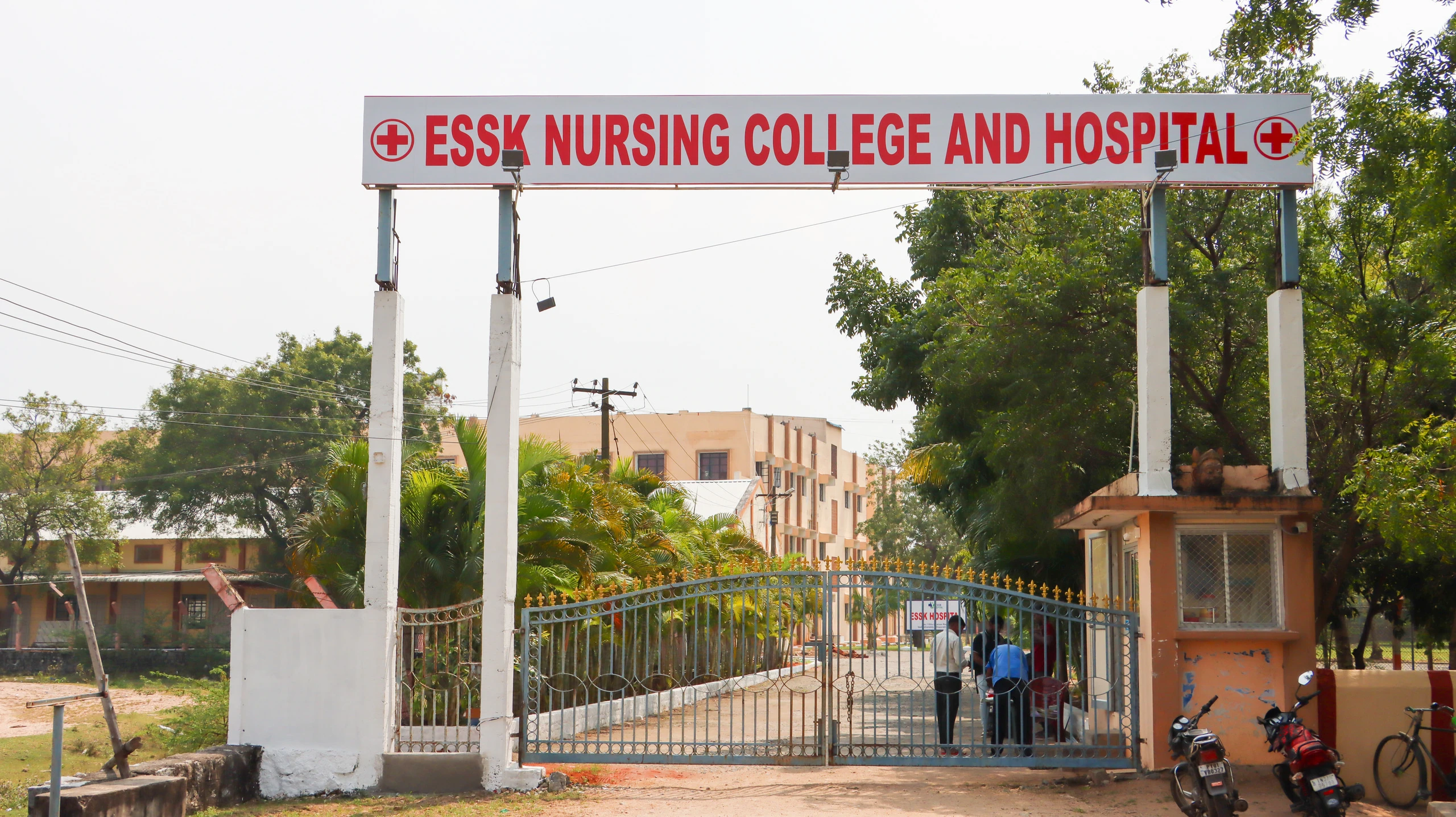 The main gate, with the sign ESSK Nursing College and Hospital